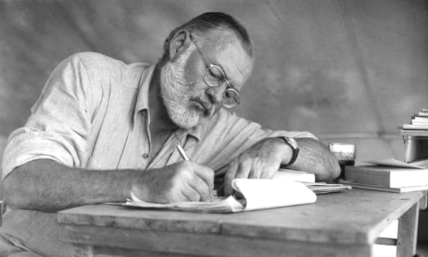 Hemingway On Safari<br>American writer Ernest Hemingway (1899 - 1961) working at a portable table while on a big game hunt in Kenya, September 1952.  (Photo by Earl Theisen/Getty Images)