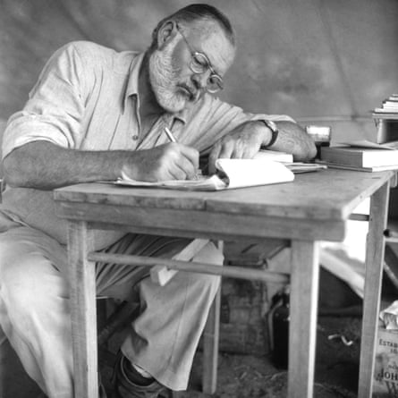 Hemingway working while on safari in 1952.