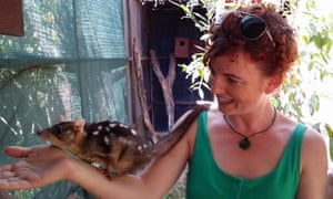 Laura Jean McKay with a quoll.