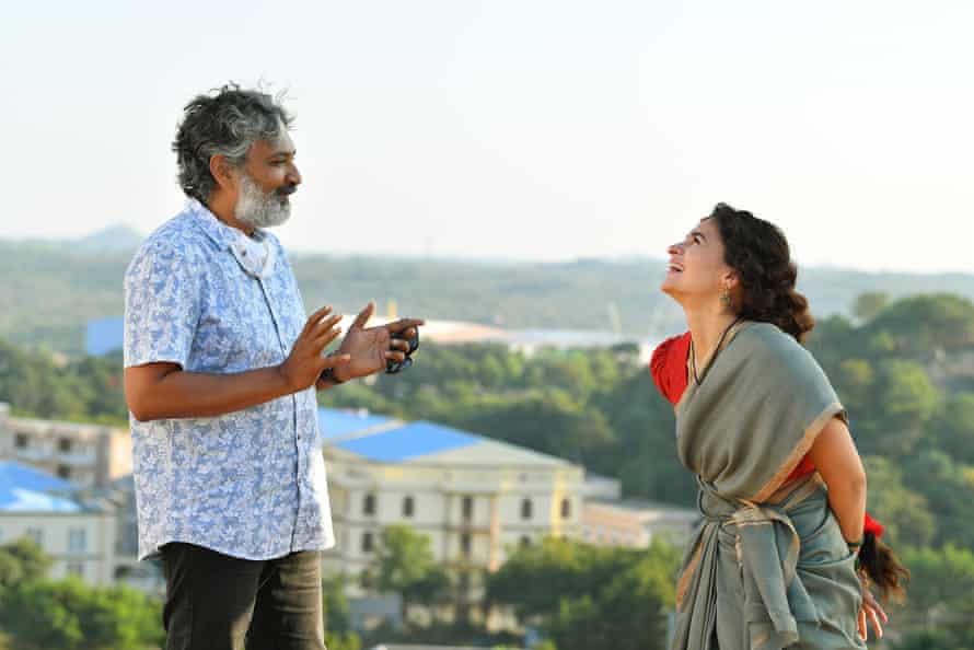 Director SS Rajamouli, left, with Alia Bhatt during filming for RRR.