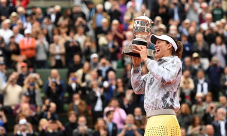 Garbine Muguruza poses with the trophy following her victory during the Ladies Singles final match against Serena Williams at the 2016 French Open.