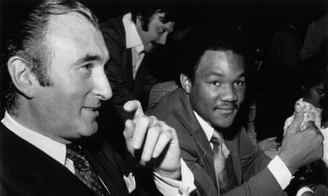 Jarvis Astaire, left, with the boxer George Foreman in 1973. 