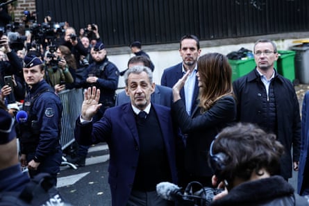 The former French president Nicolas Sarkozy leaves his Paris home to start his sentence.