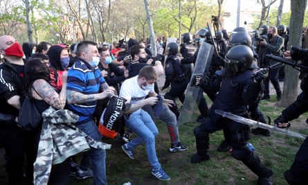 Police clash with protesters during a Vox campaign rally in Vallecas