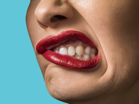 A pistillate with reddish lipstick, grimacing
