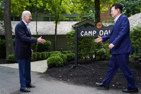 US President Joe Biden greets South Korean President Yoon Suk Yeol at Camp David in Frederick County, Maryland.
