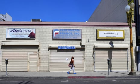 Closed shopfronts in the normally busy fashion district in Los Angeles. People in industries such as hospitality and retail have been the first to lose their jobs.