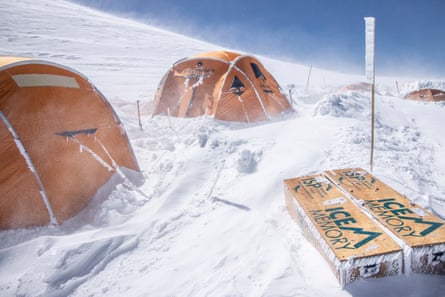 tents in snow with boxes