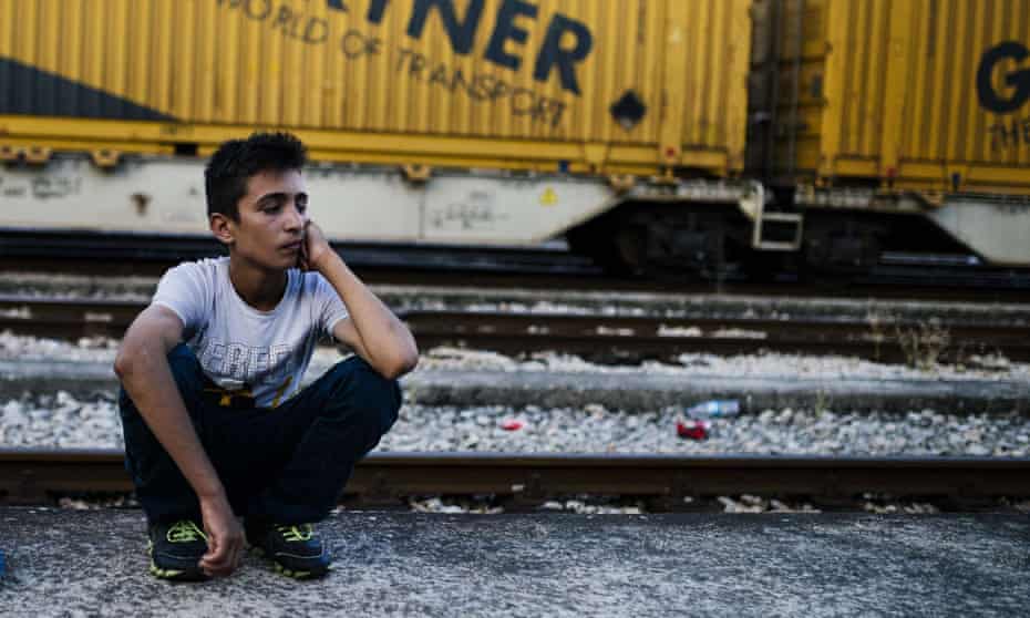 A migrant waiting for a train to Serbia at Gevgelija, on the Macedonian-Greek border.