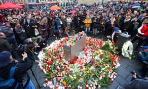 Mourners gather at the market square in Halle.