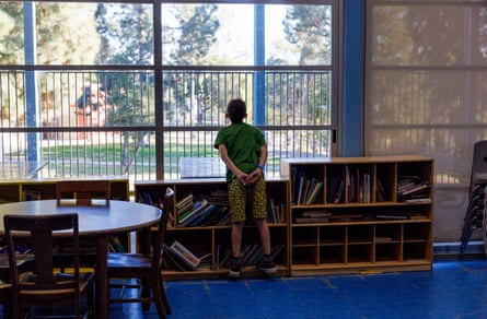 a child looks out the window
