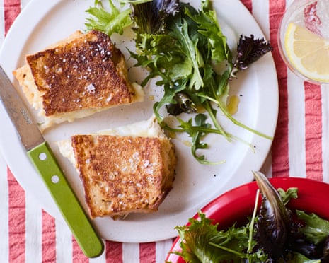 Rukmini Iyer's mozzarella in carrozza on plates with salad leaves and a drink beside it