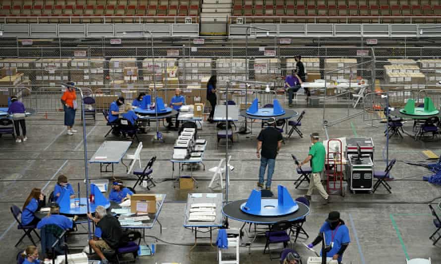 Contractors working for Cyber Ninjas examine Maricopa county ballots in Phoenix on 6 May.