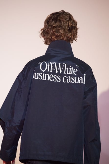 A model in a jacket bearing the words 'business casual' on the back