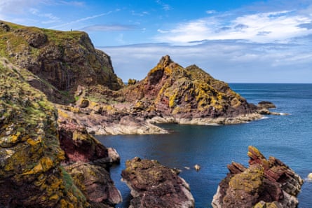 Dramatic cliffs and a blue sea on a sunny day