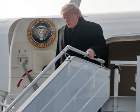 Donald Trump walking down the steps of the Air Force One plane