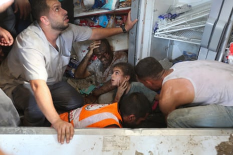 Palestinians rescue survivors of an Israeli airstrike on Rafah, in the south of the Gaza Strip, where Palestinians have been ordered to evacuate to by the Israeli military.