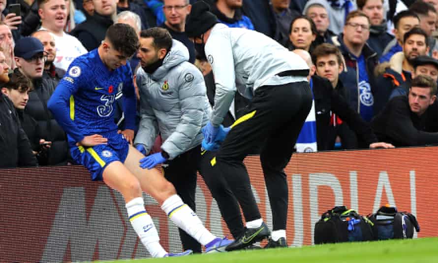 Kai Havertz receives treatment after hurtling over the advertising hoardings
