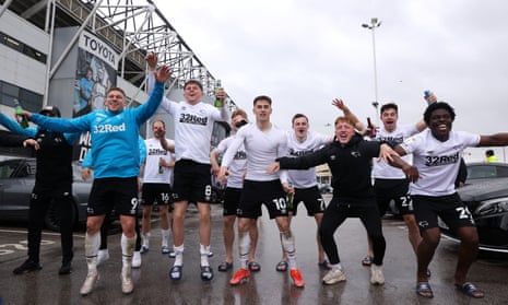 Derby players celebrate with fans outside Pride Park after sealing Championship survival.