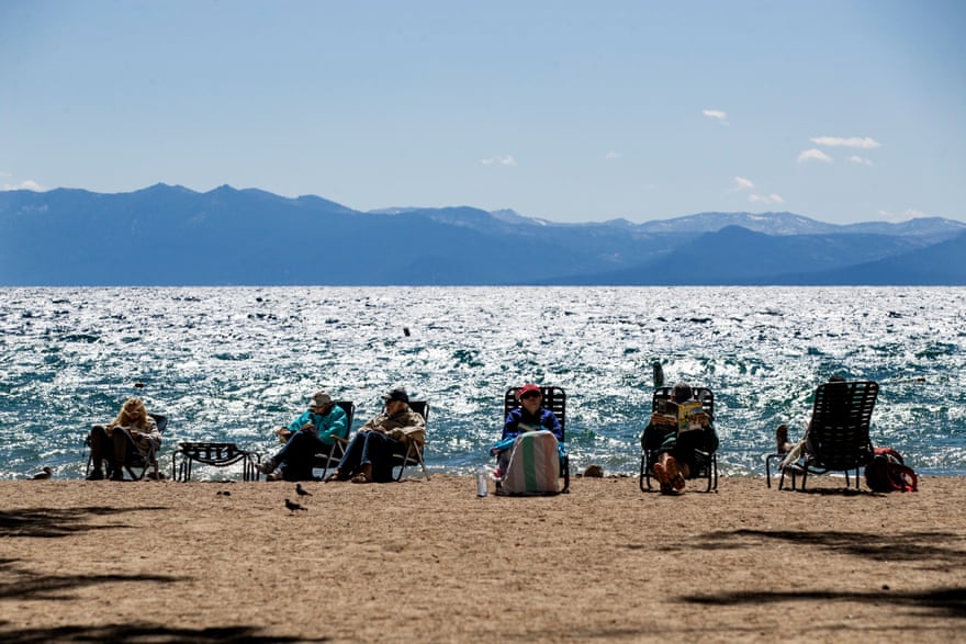 Tourists enjoy the beach next to Lake Tahoe on 8 September.