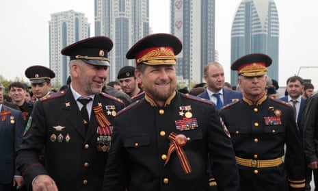 Chechen leader Ramzan Kadyrov, centre, in front of the Grozny-City complex.