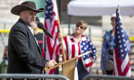 Ammon Bundy speaks to a crowd of about 50 followers in front of the Ada county courthouse in downtown Boise, Idaho.