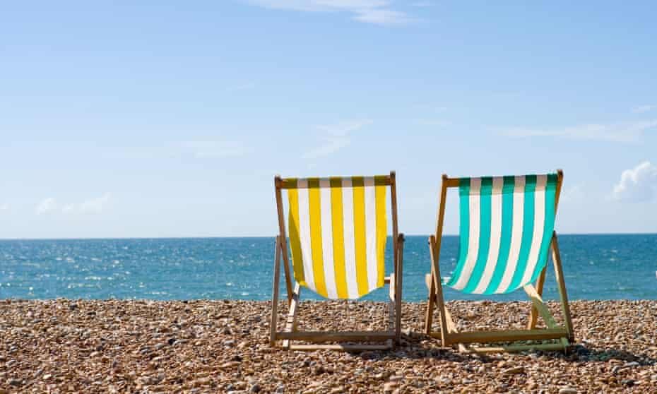 Deck chairs on Brighton beach.