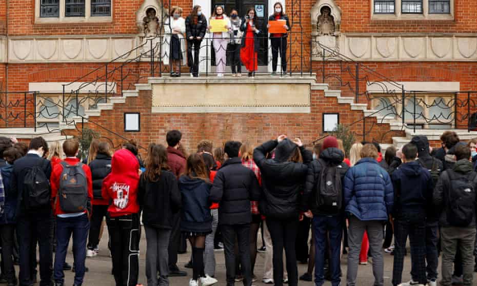 Female pupils on balcony stage a protest at Highgate School in London.