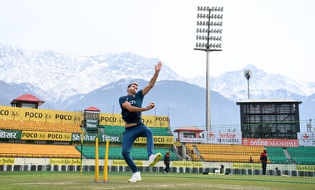 Jimmy Anderson bowls at the HPCA Stadium with the Himalayan peaks behind him