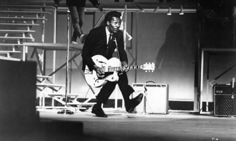 Chuck Berry performing his ‘duck walk’ on stage in Santa Monica, California, in 1964.
