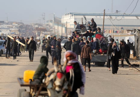 Palestinians flee from Khan Yunis to Rafah after the Israeli army called on people to leave certain areas in the city