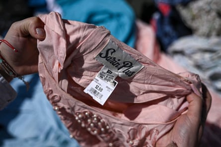 Closeup of a garment with the price tag still attached dumped in the Atacama desert in Chile.