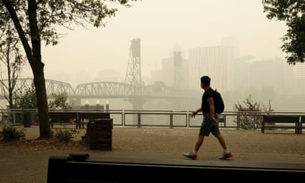 A pedestrian passes through the Villemette Bridge and downtown Portland, Oregon on Wednesday.