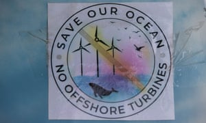 Anti windfarm stickers above Thirroul beach Illawara