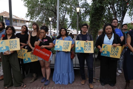 Attendees hold signs during a primary election night watch party for Democratic gubernatorial candidate Deb Haaland, Tuesday, June 2, 2026, in Albuquerque, New Mexico. (AP Photo/Jon Austria)