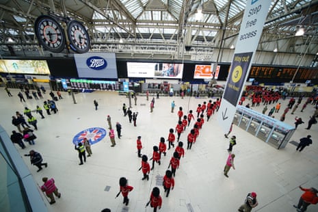 Members of the armed forces taking part in the coronation processions arrive into Waterloo station.
