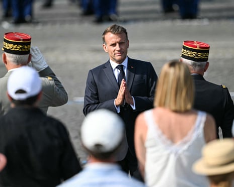 France's president Emmanuel Macron gestures during the annual Bastille Day military parade on the Champs-Elysees Avenue in Paris.