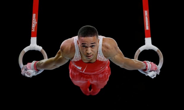 Joe Fraser of England performs on the rings .