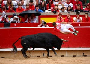 A ‘recortador’ leaps over a bull in a bullring