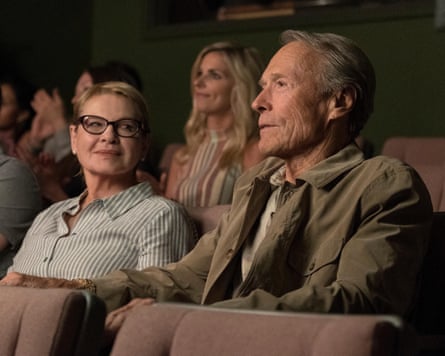 Wiest and Eastwood sit in a cinema, she looking at him, he looking at the screen