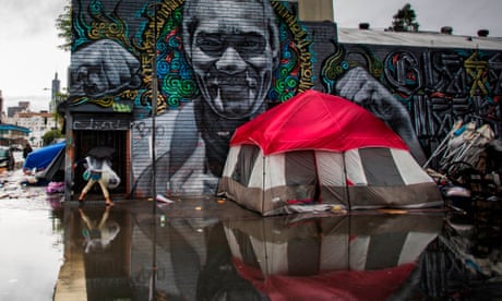 A homeless tent is seen on a flooded sidewalk in Skidrow on Thanksgiving day in Los Angeles.