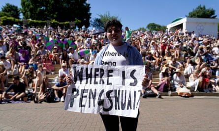 A protester holds up a sign enquiring about Peng’s whereabouts at Wimbledon in 2022