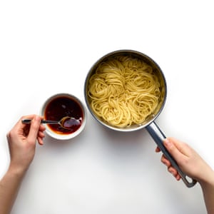 Once the noodles are cooked, add some of their starchy cooking water to the sauce, along with some chilli oil.