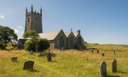 old church and graves under blue sky