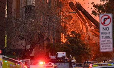 A wall collapses during a building fire in Surry Hills near Sydney’s Central station. 