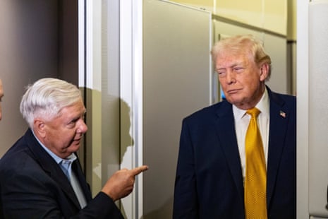 Lindsey Graham gestures as Donald Trump speaks with reporters while in flight on Air Force One in January 2026.
