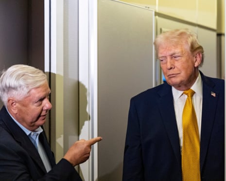 Lindsey Graham gestures at Donald Trump as the president speaks with reporters on Air Force One on 4 January 2026.