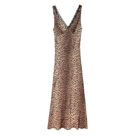 A sleeveless v neck viscose long leopard print dress. The neckline has a black lace detail.