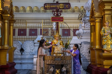 Two women pictured at Shwedagon Pagoda in Yangon.