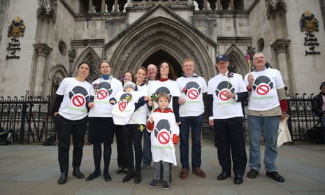 Supporters of a new legal challenge against the government over air pollution levels outside the high court in London. 